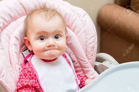 Funny Baby Girl While Being Fed In Her Pram Stock Photo Picture And Royalty Free Image Image 130629946