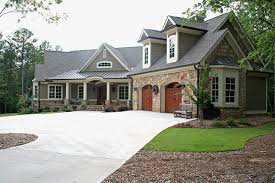 The casual, yet refined craftsman style is found in the stacked front porch, use of natural wood materials, and small details such as an oculus window over the garage. What Defines A Craftsman House Everything You Need To Know About The Style Decor Aid