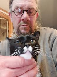 Giving DAD the side eye because I am lying in Mister's spot!!