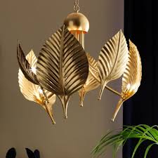 A unique ceiling pendant light made from a glass glove with an elegant brass floral leaf finish. Our Favourite Chandeliers Juliettes Interiors