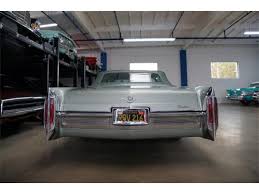 Image result for Starlight Silver 1966 Cadillac