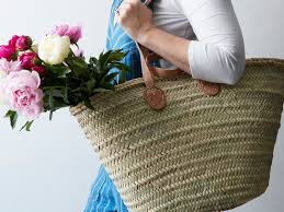 Large handmade french basket bag with bright pom poms for shopping, gym , home office storage or toy storage. French Market Basket With Double Handles On Food52
