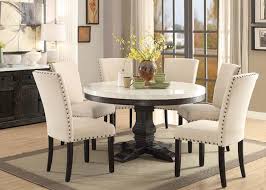 The one room that's being left alone is the kitchen space. 54 Nolan Round Marble Top Dining Room Set
