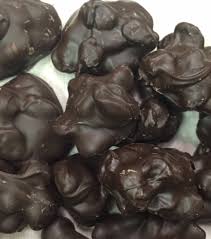 In a microwave, melt chocolate and shortening; O Shea S Dark Chocolate Raisin Cluster Osheas Candies