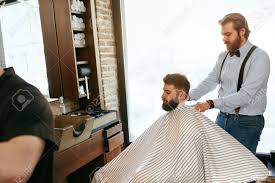 Check spelling or type a new query. Men Hair Salon Man Getting Haircut In Barber Shop Hairdresser Wearing Cape On Client High Resolution Stock Photo Picture And Royalty Free Image Image 105284826