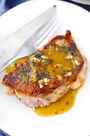 Cover the pork chops with remaining olive oil, garlic, brown sugar. Juicy Oven Baked Pork Chops With Garlic And Herbs Bowl Of Delicious