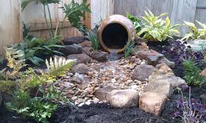 Small Water Feature In The Corner Of A Small Backyard Shade Plants And Boulders Wer Water Features In The Garden Small Water Gardens Backyard Hill Landscaping