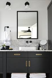 Select a vanity with a contrasting color top like cream or white for a standout look. Black Vanity Bathroom Bathroom Vanity Designs Black Cabinets Bathroom