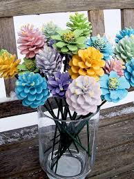You could even make a bouquet using a single color, like red to replicate a rose or yellow for a sunflower. How To Turn Pine Cones Into Lovely Zinnia Flowers The Whoot