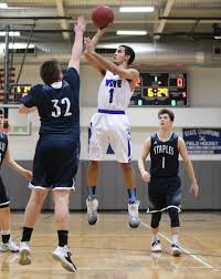 Darien boys basketball defeats Staples
