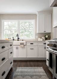 Neutral Kitchen Dark Wood Floors Stainless Steel Appliances White Farmhouse Si Kitchen Cabinet Door Styles White Kitchen Design Best Flooring For Kitchen