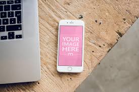 Mockup Generator Template Featuring A White Iphone On A Wooden Table Next To A Macbook Laptop Place Your Own Design Onto The White Iphone Iphone Iphone Mockup