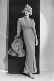Bette davis knitting on the set of the bride came c.o.d, 1941. 1930s Bette Davis In A Full Length Knitted Dress With Four Inverted Pleats Starting At The Knee Costumeporn