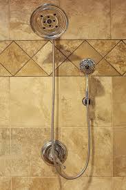 Fixed Shower Head With Separate Wand In Front Of Gorgeous Earth Tone Tile Bathroom Design Decor Design Remodel Fixed Shower Head
