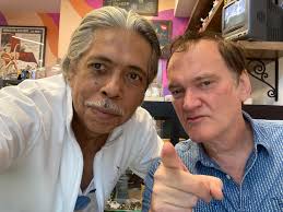 Went up to Hollywood to visit Tarantinos's Vista theater and the Pam Grier  dedicated coffee shop and who's sitting there writing his next masterpiece?  The man himself. Very Rare photo since no