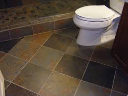 The vivid color and unique pattern contrast with the simple bathtub and wide gray floor tiles, which enrich the bathroom style. Tile Flooring Ausihome