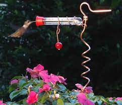 Stake in your garden, hang it from a hook or stick it to your window for your viewing pleasure! Duncraft Com Flower Pot Hummingbird Feeder Humming Bird Feeders Flower Pots Bird Feeders