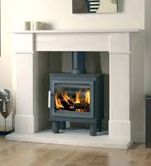 Modern insulation, glazing and central heating systems mean that working stoves are no longer a prerequisite, but their a statement fireplace can add some real wow factor to a space.when you're choosing a stove for larger zones, don't feel limited to installing it in a corner or against a wall. Amazing Log Burner Fireplace Surround Ideas Direct Stoves