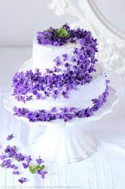 Beautiful White Tiered Cake With Violets Violet Cakes Floral Cake Pretty Cakes