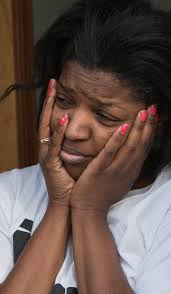 Mother sheds tears days after Christmas fire as firefighters bring gifts  for her children