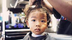 My Son S First Haircut At A Black Barbershop Popular Mens Haircuts First Haircut Natural Hair Care Tips