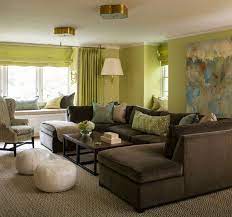 Green And Brown Living Room Features Walls Painted Green Lined With A A Large Gray An Brown And Green Living Room Living Room Turquoise Brown Living Room Decor