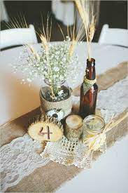 Yellow And White Wedding With Lots Of Hops Rustic Wedding Centerpieces Wedding Centerpieces Beer Bottle Centerpieces