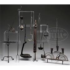 More information provided at www.amazinggates.com. Thirteen Early American Wrought Iron Lighting And Hearth Items