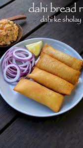 Dahi Ke Sholay Recipe Dahi Bread Roll Bread Curd Fire Roll Dahi Ke Sholey Video Recipe Video In 2020 Indian Snack Recipes Indian Food Recipes Pakora Recipes