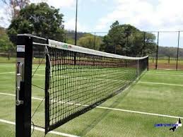 The tennis net is placed directly in the center of the court. Other Used Tennis Net