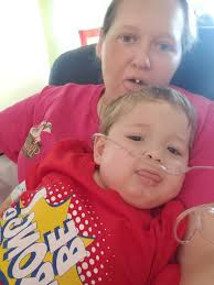 What is the cause of Landyn's abdominal distention and kidney issues?