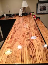 Our countertops are sanded and maintained. Bar Made Out Of Oak Hardwood Flooring I Torched The Wood Before Applying Clear Coat Wood Bar Top Reclaimed Wood Bars Torch Wood