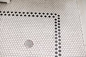 Black And White Penny Tile Designs Steal This Look Perfect Powder Room At Joan S On Third Remodelista Hexagon Tile Bathroom Floor Bathroom Floor Tiles Bathroom Tile Designs