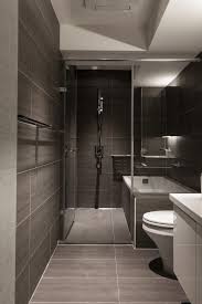 A Minimalist Bathroom Uses A Soothing Soya Bean Colored Large Wall Tiles And Floor Ti Bathroom Design Small Modern Best Bathroom Designs Modern Small Bathrooms