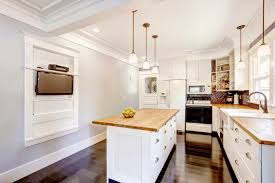 This one wall kitchen with island has the pendants suspended. Freestanding Cabinets Offer A Classic Kitchen Look