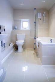 Totally renovated bathroom with shower cabin and bathtub,light cream coloured tiles on floor and wall. Big Floor Tile In Small Bathroom Novocom Top