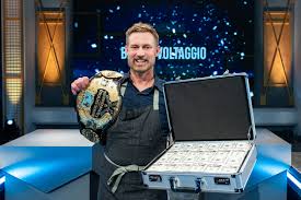 Winning contestant Bryan Voltaggio with prize money and belt, as seen on Tournament of Champions, Season VII | Pressroom