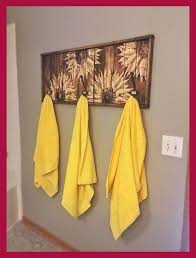 The unique yellow sunflower design paired against its detailed black and white background make this piece a tapestry staple! Large Carved Wood Sunflower Floral Wall Art Rustic Wooden Functional Bathroom Art Decor Sunfl Sun Bathroom Art Decor Sunflower Home Decor Dining Wall Decor