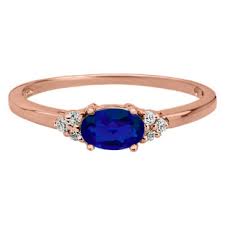 A timeless engagement ring featuring two beautifully matched pear shape blue sapphires accenting the center diamond of your choice. Petite Oval Cut Blue Sapphire Gemstone Diamond Rose Gold Ring Gemologica A Fine Online Jewelry Store