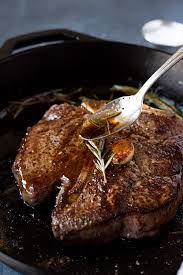 Heat a cast iron skillet for 20 minutes in the oven. T Bone Steak With Garlic And Rosemary Recipe Kitchen Swagger