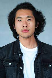 Asian Guy Lions Mane Headshot Black Denim Jacket Over White T No Smile Serious Headshots Model Photo And Video