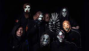 He was the drummer for a thrash metal band called modifidious, which opened for a band called atomic opera, of which future slipknot guitarist jim root was a member, per slipknot: Slipknot Unmasked Photos Support Tortilla Man Identity Theory