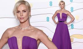 BAFTAs 2020: Nominee Charlize Theron in plunging purple gown | Daily Mail  Online