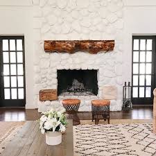Update rock or bricks easily and transform your space! Farmhouse Family Room With Painted White Fireplace Painted River Rock Fireplace Farmhouse Wit River Rock Fireplaces Painted Rock Fireplaces Fireplace Remodel