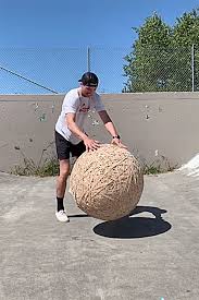 Jeremiah warlick tests the strength of a watermelon with his comical video; Sequim Grad Turns To Tiktok To Become Rubber Band Ball Guy Sequim Gazette