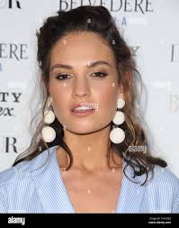 Lily James arriving for the DuJour Magazine Summer Issue Party with Cover  Star Lily James held at Beauty & Essex, Hollywood Stock Photo