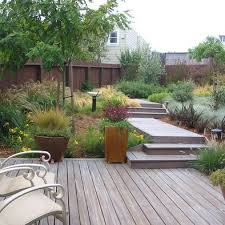 It's a relaxing space, conducive to being. Australian Native Garden Design Back Garden No Grass Just Plants Decking Modern Landscaping Backyard Landscaping Modern Landscape Design