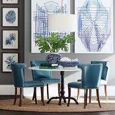 Cushioned black armrests top a black tubular steel frame. Regency Leather Side Chair Williams Sonoma