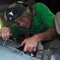 Machinist Mate Fireman Vincent Strickland records low-pressure air gauge  readings aboard the aircraft carrier USS Nimitz (CVN 68).