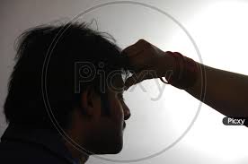 Image of Silhouette Of Woman Making Sindhuur Or Thilakam To A Man ...